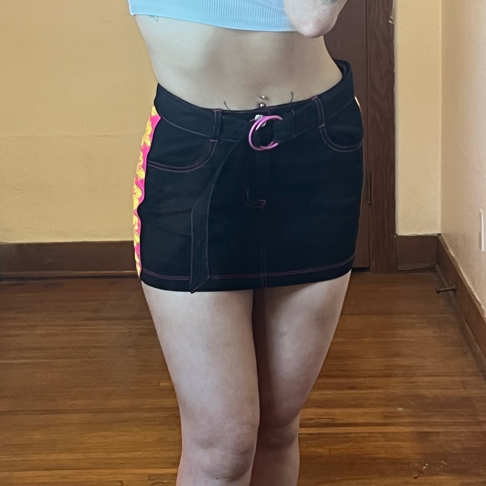 Black mini skirt with pink and yellow Hawaiian flowers